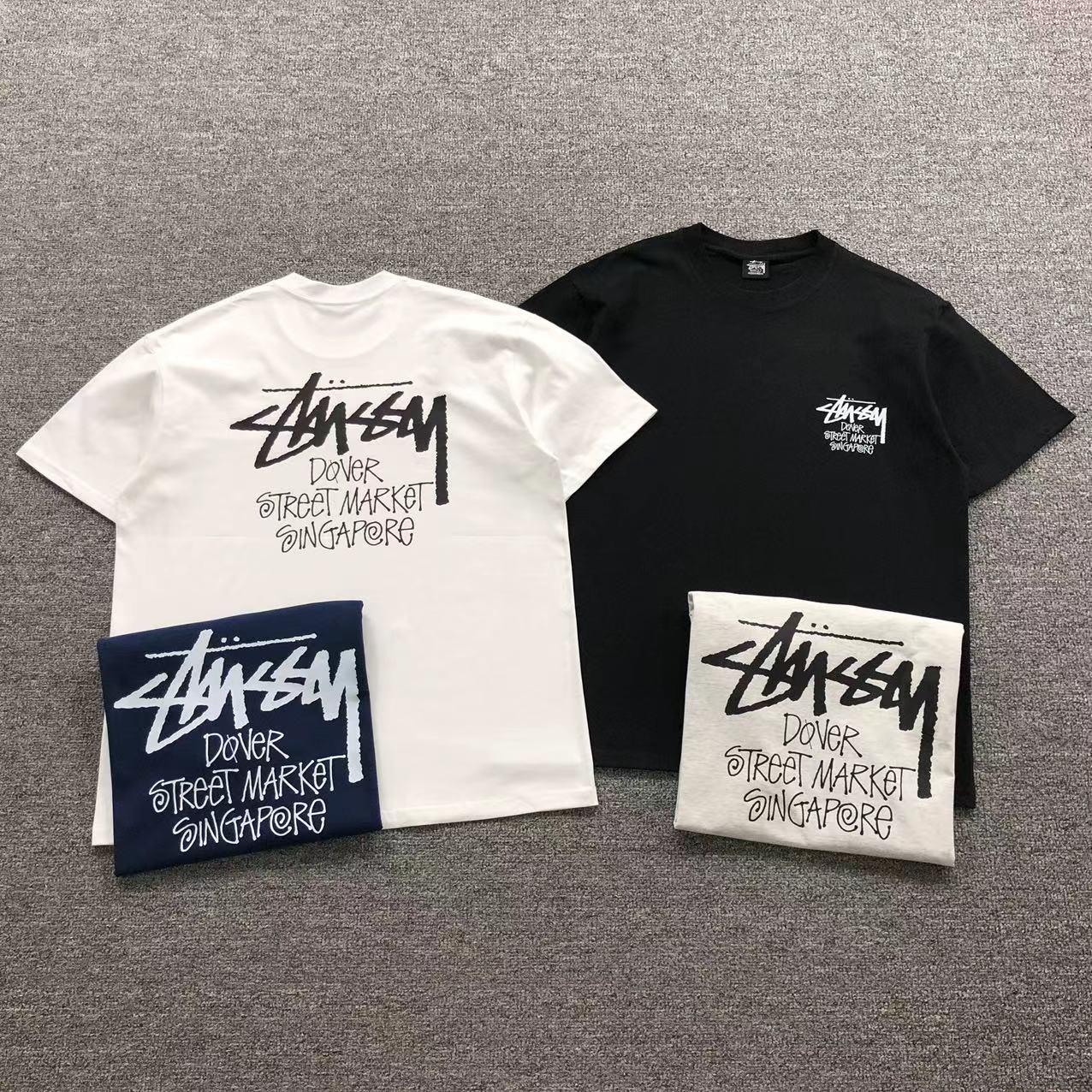 Camisa Stussy Dover Street Market Disponível Em Branco, Preto, Azul Marinho E Cinza Mescla — frente