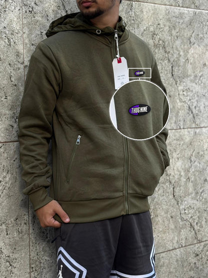 Casaco Moleton Ziper Importado Velvet Street 2026 Verde Militar com patch Thug Nine Oval Preto Com Roxo