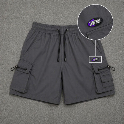 Short Cargo Streetwear Dual Pocket Cinza Chumbo com patch Thug Nine Oval Preto Com Roxo