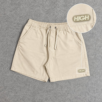 SHORT SARJA MAURICINHO AREIA com patch High Resina Oval Bege